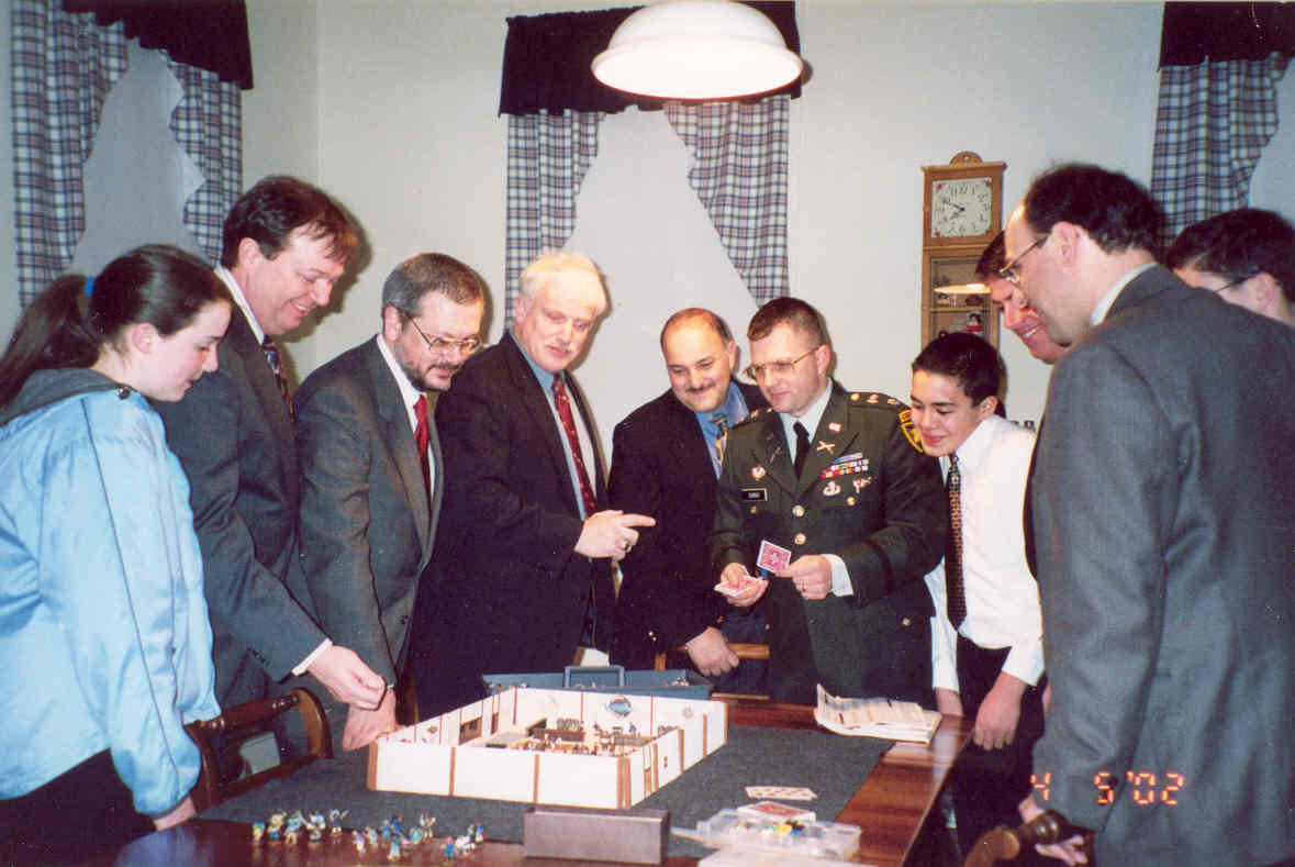 Picture of gamers playing Blood and Swash in coats and ties